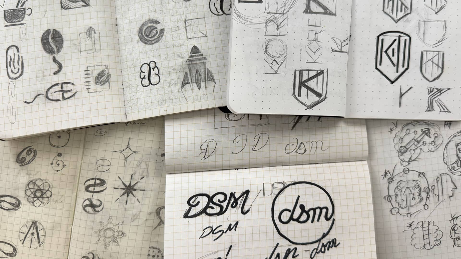 Image of logos sketches and potential ideas for design projects.